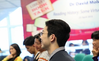 student listening and smiling